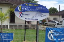 Oval shaped Sign, 2 businesses